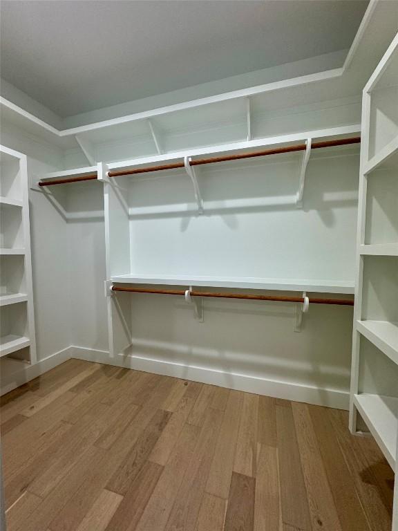 1708 Canterbury St Unit 1, Austin, TX 78702 - walk in closet with wood finished floors