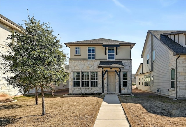 view of front of home with a front lawn