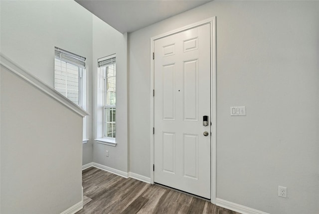 entryway with dark hardwood / wood-style floors