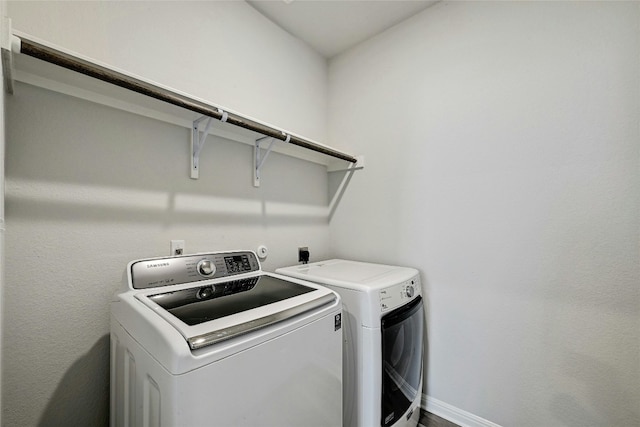 laundry area featuring washing machine and clothes dryer