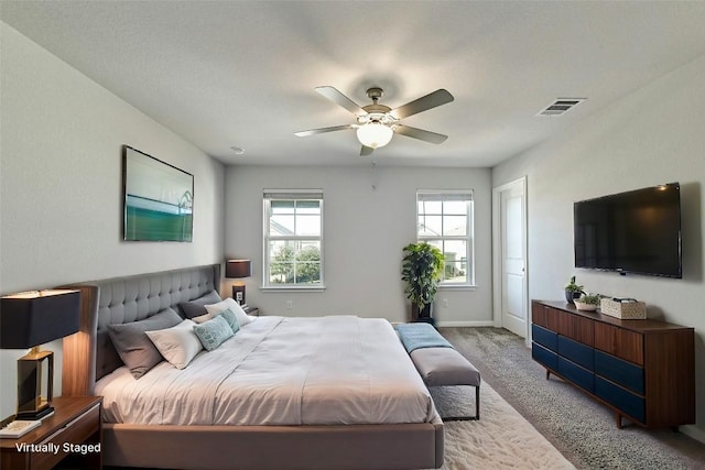 carpeted bedroom with ceiling fan