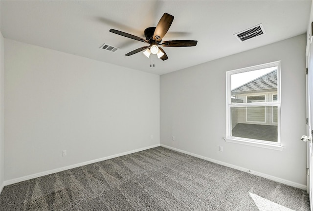 carpeted empty room featuring ceiling fan