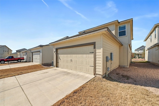 view of side of home with a garage