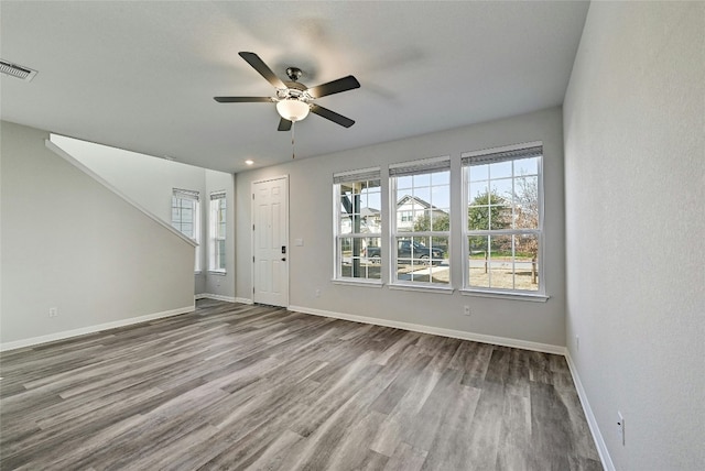 unfurnished living room featuring hardwood / wood-style floors and ceiling fan