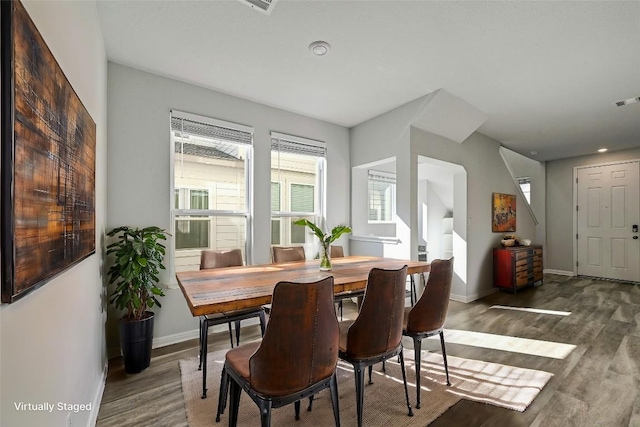 dining space featuring dark hardwood / wood-style floors