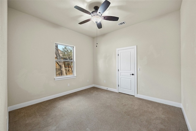 carpeted empty room featuring ceiling fan