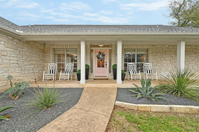 view of exterior entry featuring a porch