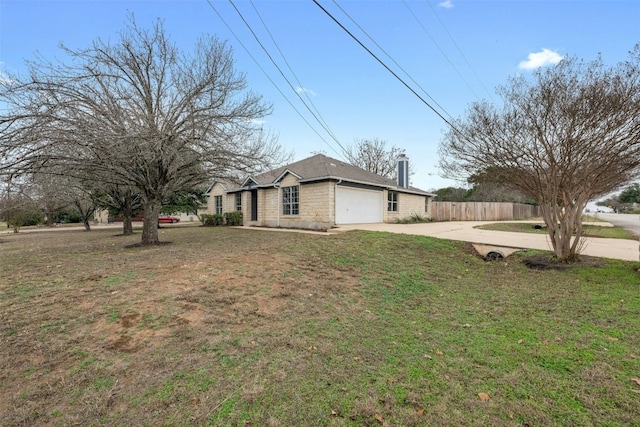 view of side of home featuring a garage and a lawn