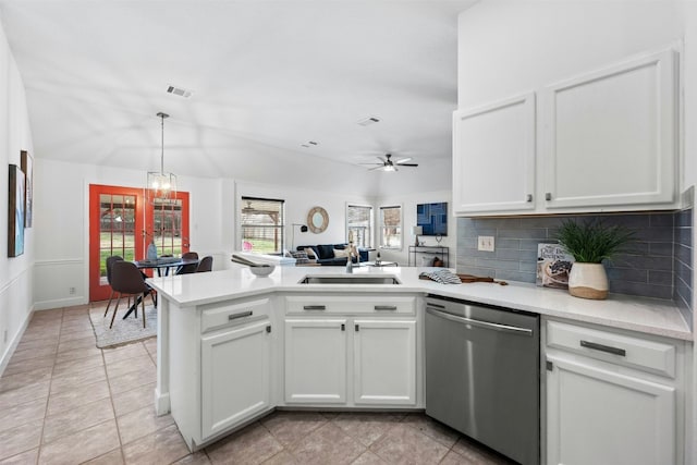 kitchen with sink, white cabinets, kitchen peninsula, and dishwasher