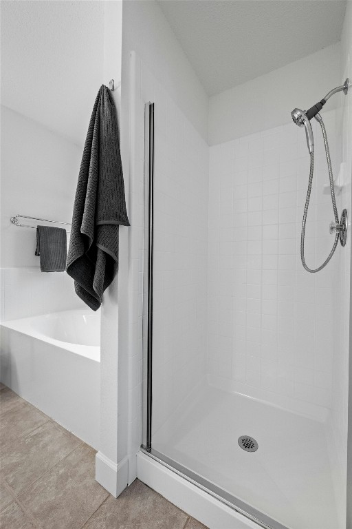 bathroom with a tile shower