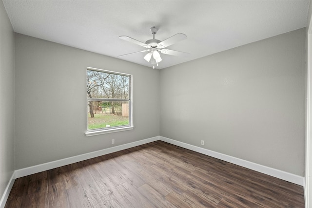 empty room featuring hardwood / wood-style flooring and ceiling fan