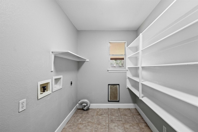 laundry room with washer hookup, hookup for an electric dryer, and light tile patterned flooring