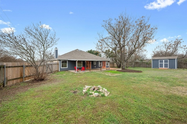 view of yard with a storage unit and a patio area