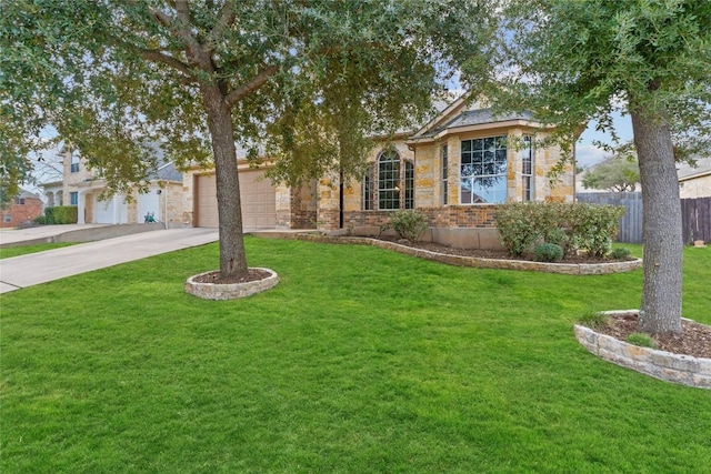 view of front facade with a garage and a front lawn