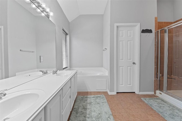 bathroom with vaulted ceiling, separate shower and tub, tile patterned floors, and vanity