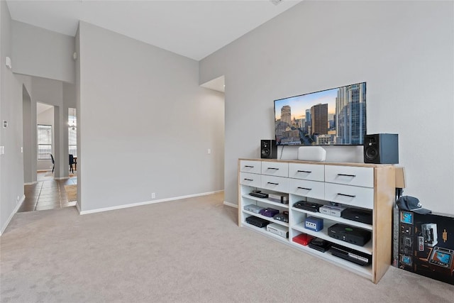 interior space featuring vaulted ceiling and carpet