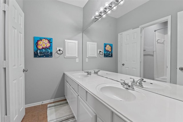 bathroom with vanity, tile patterned flooring, and bathtub / shower combination