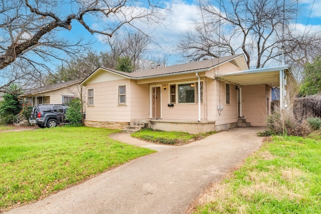 ranch-style house with a carport and a front yard