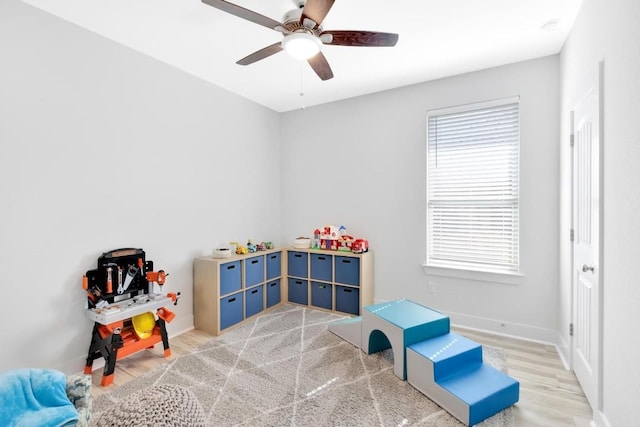 recreation room featuring hardwood / wood-style floors and ceiling fan