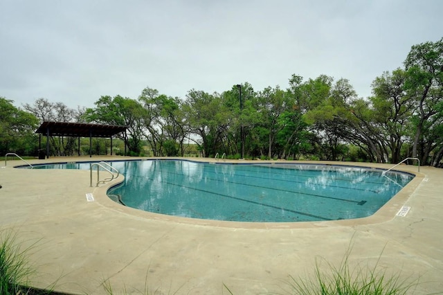 view of swimming pool featuring a patio