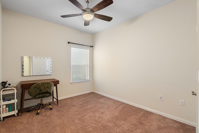 carpeted office space featuring ceiling fan