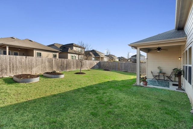 view of yard with ceiling fan