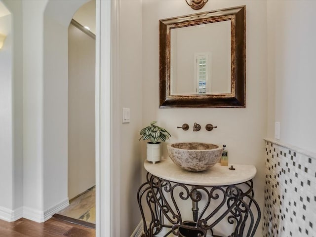 bathroom featuring wood-type flooring and sink