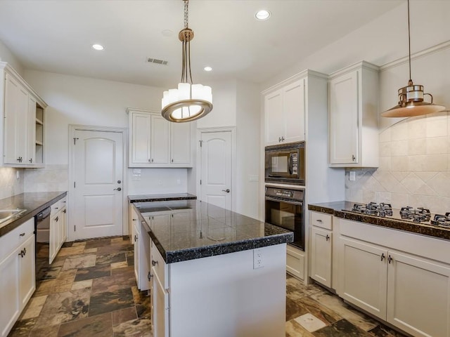 kitchen with white cabinetry, black appliances, a center island, hanging light fixtures, and backsplash