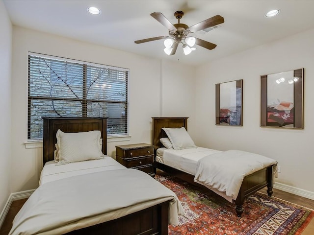 bedroom featuring hardwood / wood-style flooring and ceiling fan