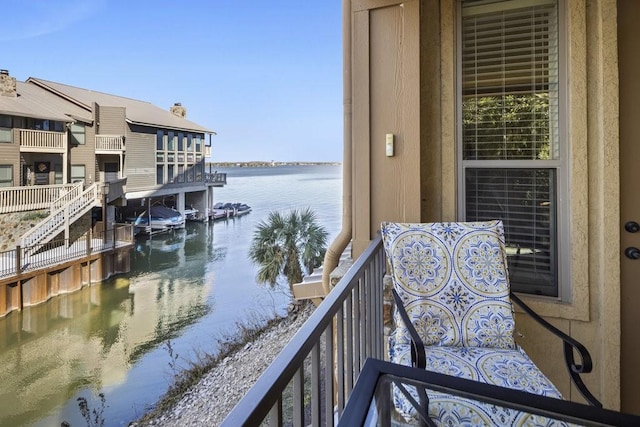 balcony featuring a water view