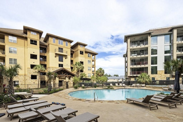 view of swimming pool with a patio area