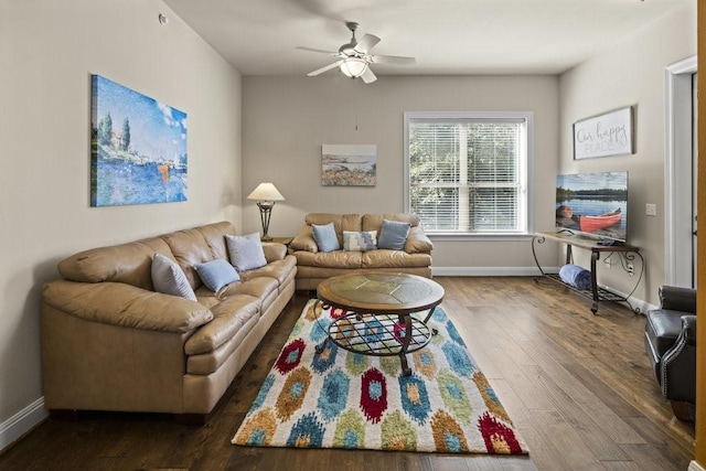 living room with ceiling fan and dark hardwood / wood-style floors