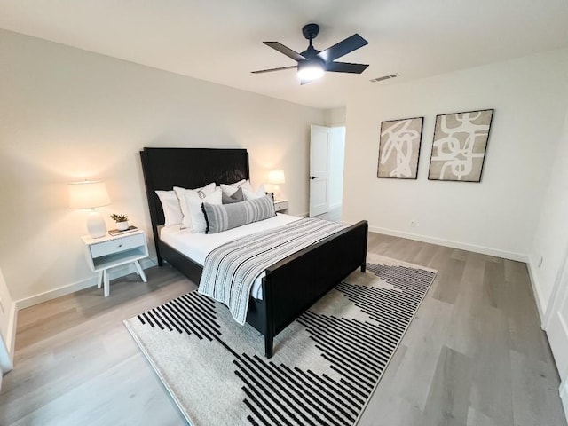 bedroom featuring hardwood / wood-style flooring and ceiling fan