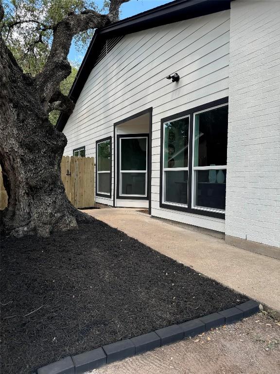 view of side of property featuring a patio area