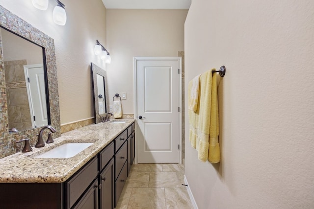 1005 Highknoll Ln, Georgetown, TX 78628 - full bath featuring double vanity and a textured wall