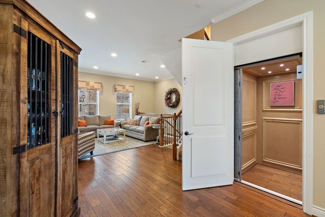 1005 Highknoll Ln, Georgetown, TX 78628 - living room with ornamental molding, dark wood finished floors, and recessed lighting