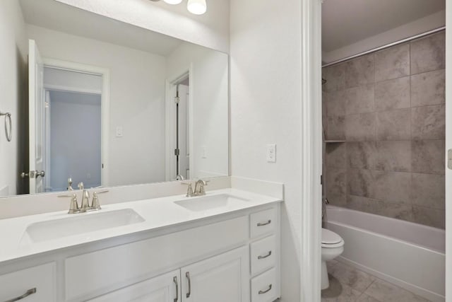 full bath with tub / shower combination, a sink, toilet, and double vanity