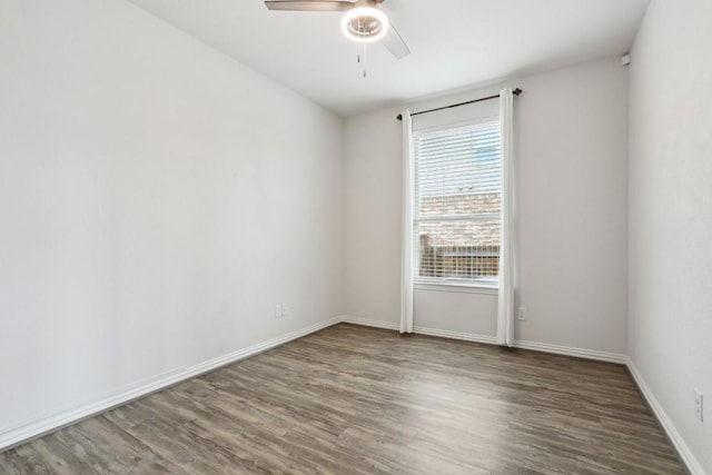 empty room featuring hardwood / wood-style floors and ceiling fan