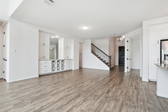 unfurnished living room featuring light wood-type flooring