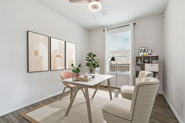 office featuring a ceiling fan, baseboards, and wood finished floors