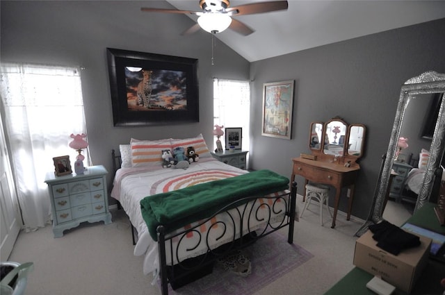 bedroom with ceiling fan, carpet flooring, and vaulted ceiling