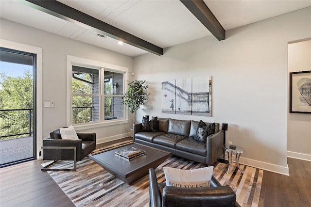 living room featuring hardwood / wood-style floors and beamed ceiling