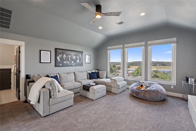 living room with lofted ceiling, light carpet, and ceiling fan