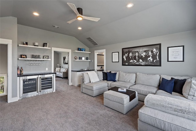 carpeted living room featuring bar, wine cooler, lofted ceiling, and ceiling fan