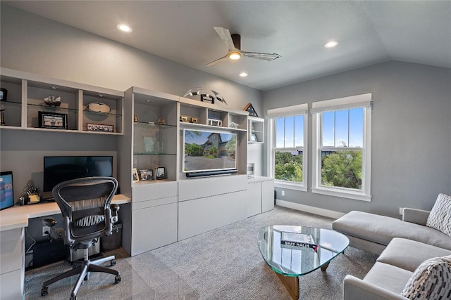 home office with ceiling fan, light colored carpet, and vaulted ceiling