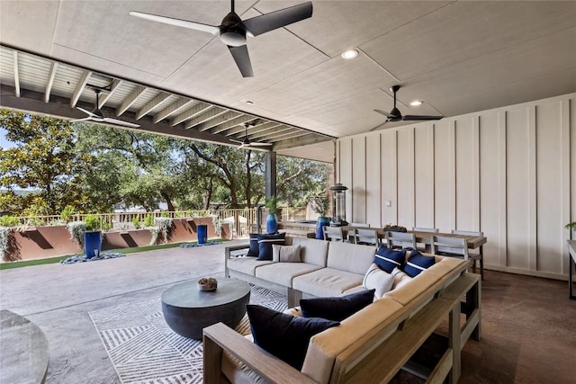 view of patio featuring ceiling fan, outdoor lounge area, and a swimming pool