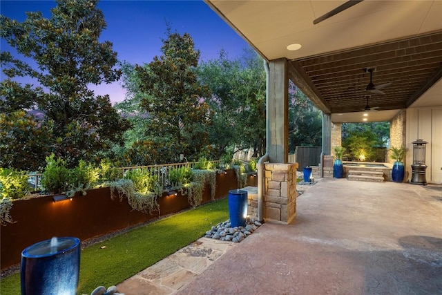 patio terrace at dusk with ceiling fan