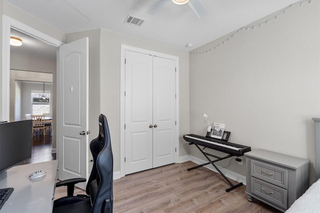 office featuring ceiling fan and light wood-type flooring