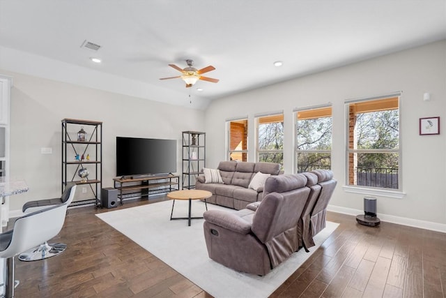 living room with dark hardwood / wood-style floors and ceiling fan