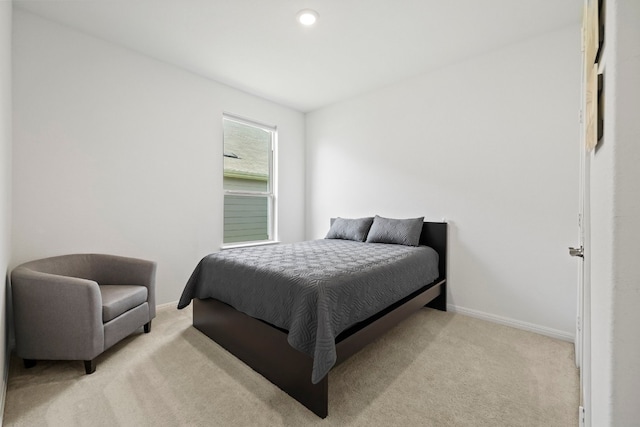 bedroom featuring light carpet